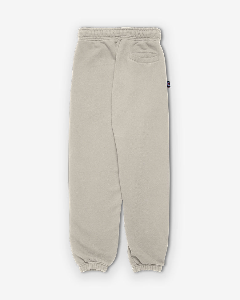 Back view: Curved yoke and button closure on beige terries