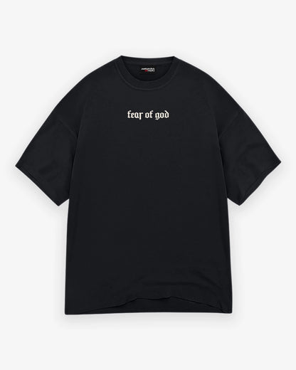 Black t-shirt with 'fear of god' text on a white background