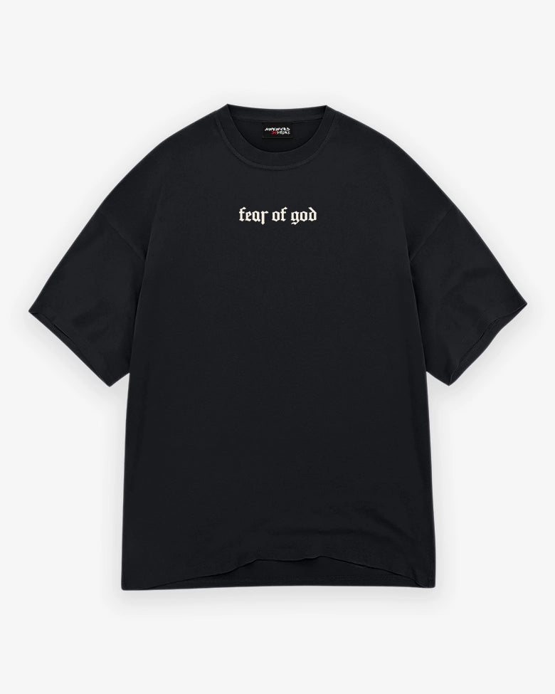 Black t-shirt with 'fear of god' text on a white background